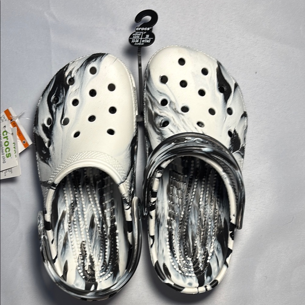 Crocs women’s Black and White Clogs
